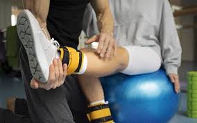 Patient working with a provider at a performance physical therapy clinic in Columbus, OH during a one-on-one movement assessment
