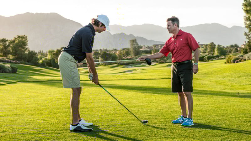 Golfer working with TPI instructor